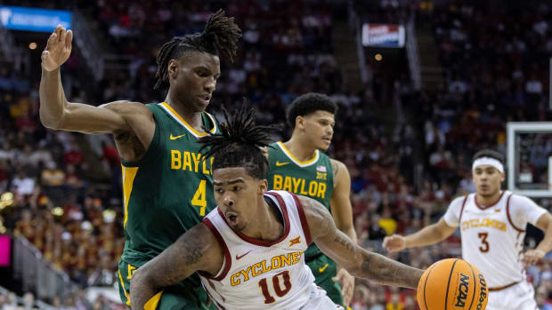 Mar 15, 2024; Kansas City, MO, USA; Iowa State Cyclones guard Keshon Gilbert (10) drives to the basket around Baylor Bears guard Ja'Kobe Walter (4) during the first half at T-Mobile Center. 